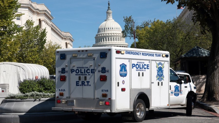 Authorities investigate a suspicious vehicle in downtown Washington, D.C.