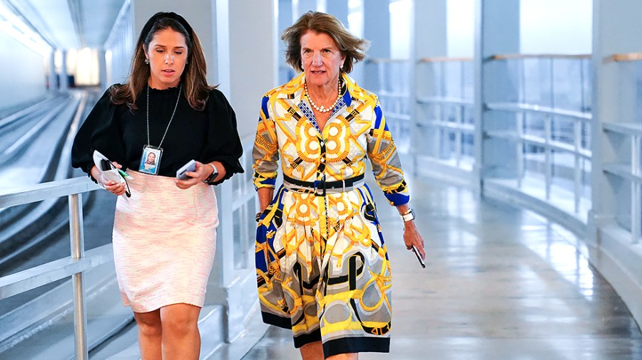 Sen. Shelley Moore Capito (R-W.Va.) speaks to an aide as she arrives to the Capitol for a vote on Tuesday, July 27, 2021.