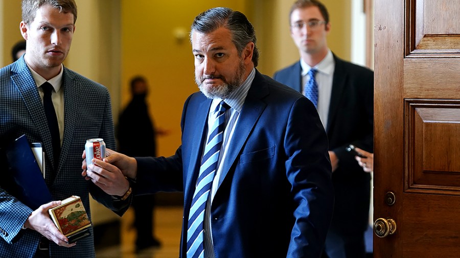 Sen. Ted Cruz (R-Texas) leaves a meeting with Senate Republicans to discuss the bipartisan infrastructure bill on Wednesday, July 28, 2021.