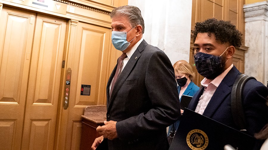 Sen. Joe Manchin (D-W.Va.) arrives to the Capitol for a vote to end debate regarding the bipartisan infrastructure bill on Sunday, August 8, 2021.