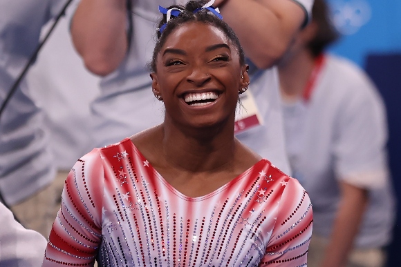 Simone Biles of Team United States reacts during the Women's Balance Beam Final