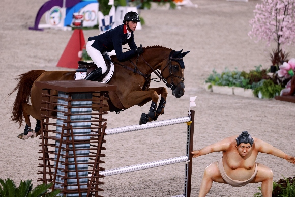 Britain's Ben Maher riding Explosion W competes in the equestrian's jumping individual finals