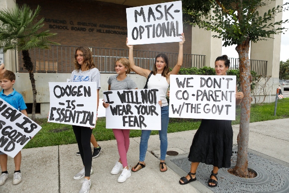  Families protest any potential mask mandates before the Hillsborough County Schools Board meeting in Tampa