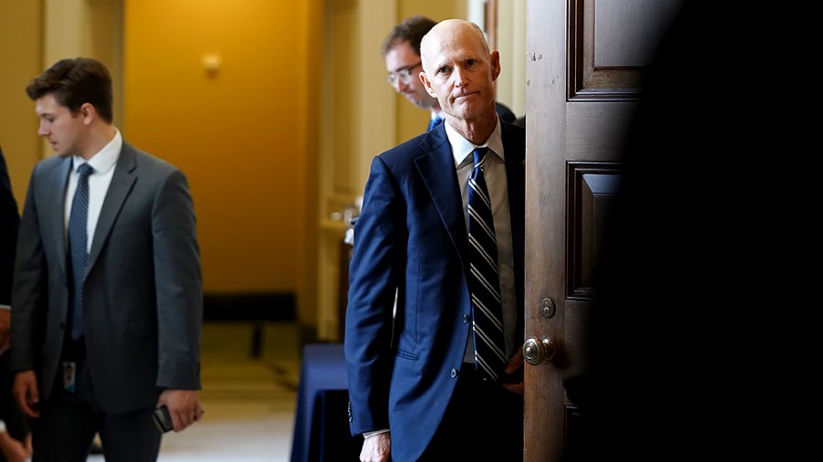 Sen. Rick Scott (R-Fla.) leaves a meeting with Senate Republicans to discuss the bipartisan infrastructure bill on Wednesday, July 28, 2021.