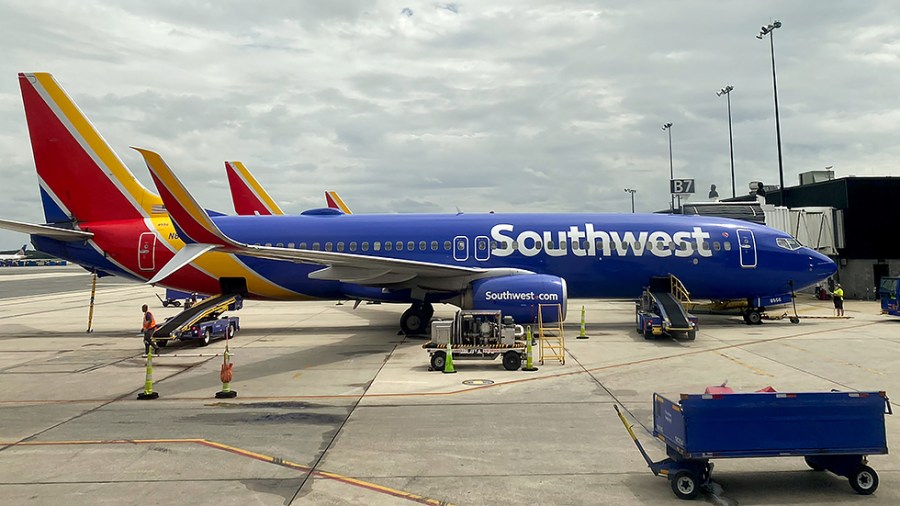 A Southwest Airlines plane is parked at Terminal B at BWI Airport in Baltimore, Md., on Monday, August 16, 2021.