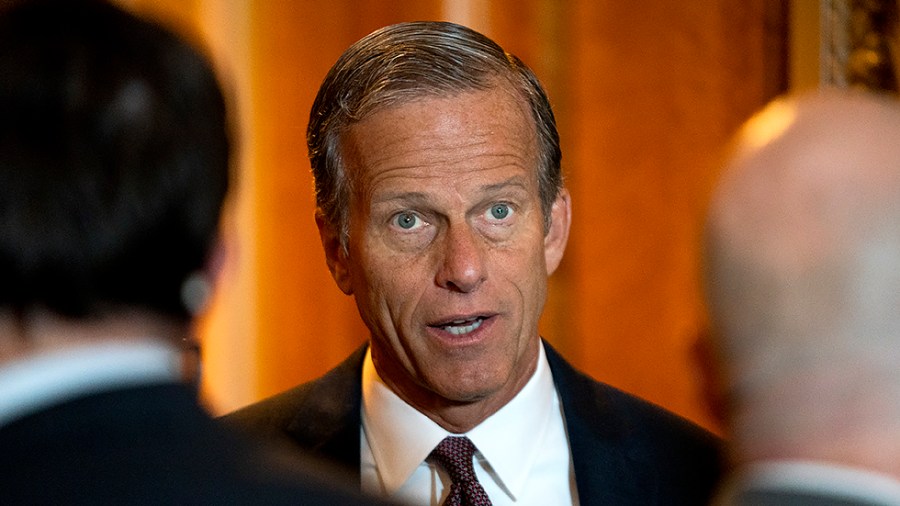 Sen. John Thune (R-S.D.) speaks to reporters outside the Senate Chamber as the Senate votes on the bipartisan infrastructure bill on Tuesday, August 10, 2021.