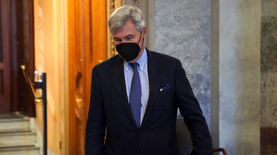 Sen. Sheldon Whitehouse (D-R.I.) leaves the Senate Chamber after a cloture vote regarding the bipartisan infrastructure bill on Saturday, August 7, 2021.