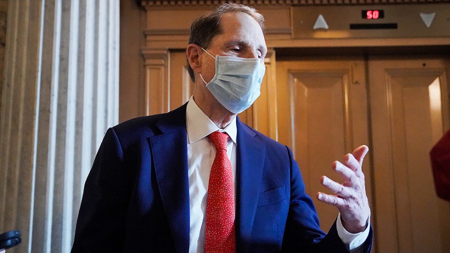 Sen. Ron Wyden (D-Ore.) speaks to reporters outside the Senate Chamber on Tuesday, August 3, 2021 as the Senate takes up amendments regarding the bipartisan infrastructure bill.