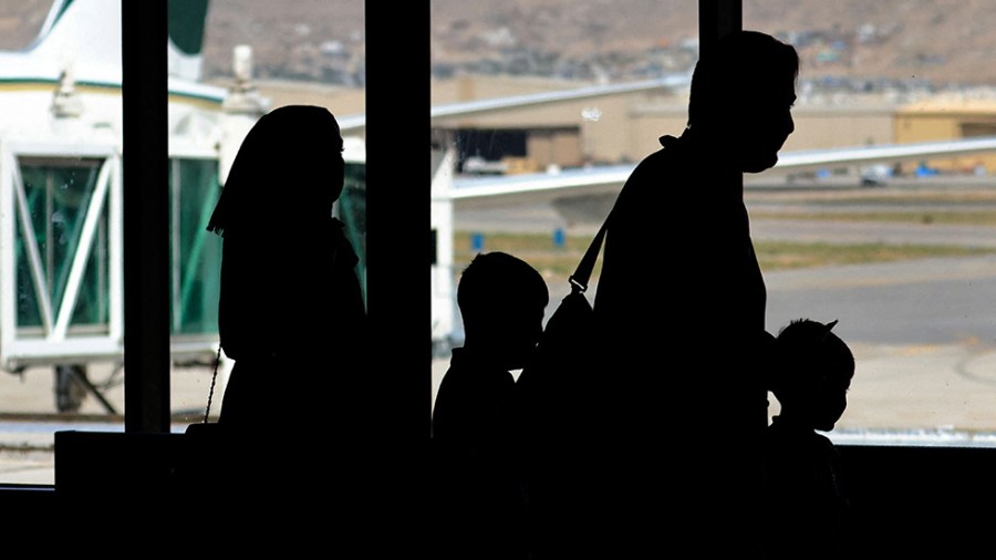 Passengers leave to board on a Pakistan International Airlines plane