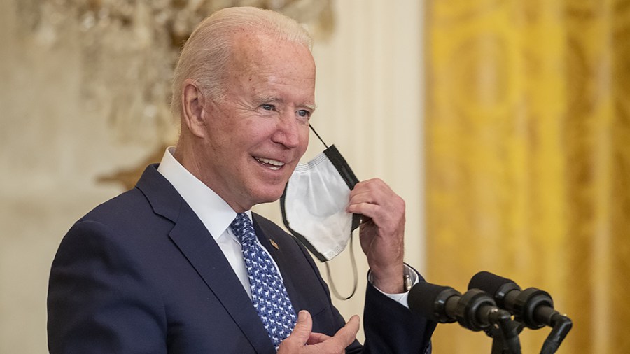 President Biden removes his mask before delivering remarks in honor of labor unions during an event in the East Room of the White House on Wednesday, September 8 2021.