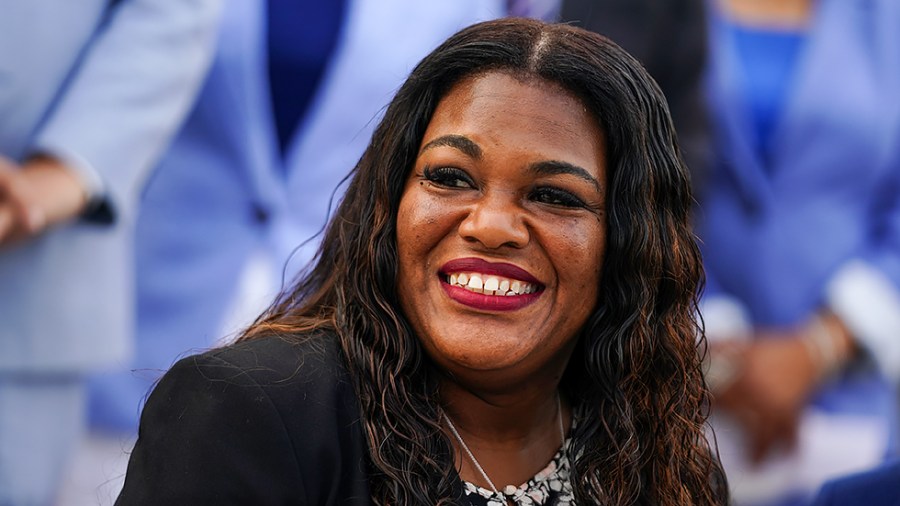 Rep. Cori Bush (D-Mo.) is seen as members Congressional Progressive Caucus take a photo outside the House Chamber on Monday, July 19, 2021.