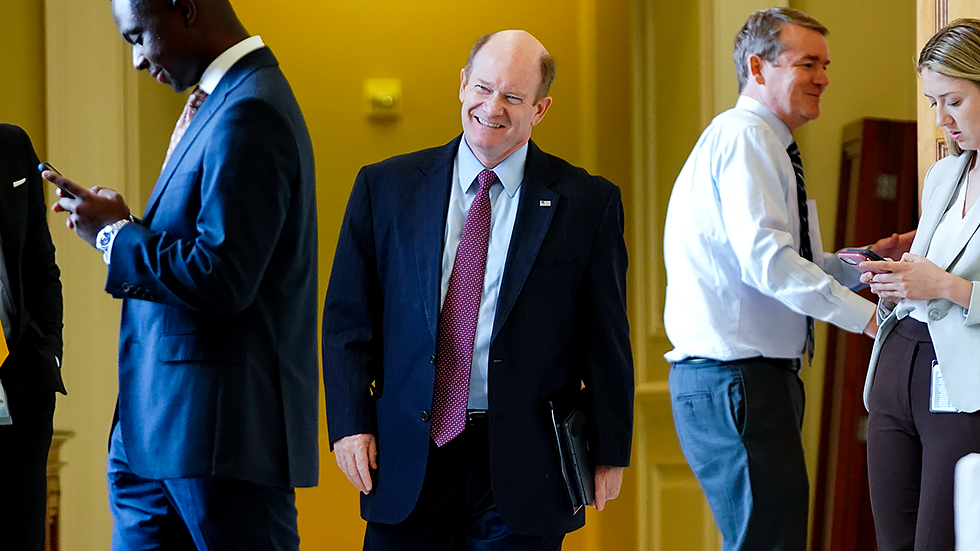 Sen. Chris Coons (D-Del.) leaves the weekly Senate Democratic policy luncheon on Tuesday, June 15, 2021.