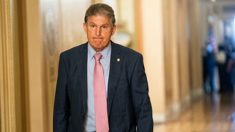 Sen. Joe Manchin (D-W.Va.) leaves the Capitol during a series of nomination votes on Wednesday, September 22, 2021. He'll be meeting with President Biden to discuss the bipartisan infrastructure package and reconciliation package.