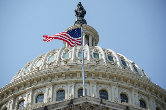 An American flag flies on the East Front of the U.S. Capitol