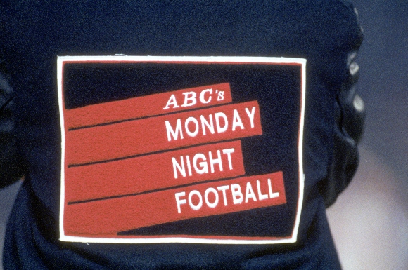 Detail view of the ABC Monday Night Football logo on the back of a black and blue letterman jacket