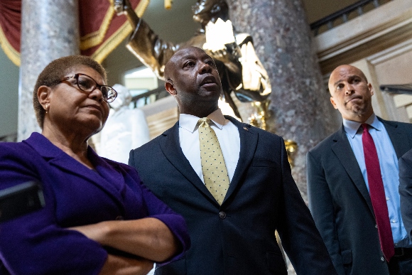 Rep. Karen Bass (D-CA), Sen. Tim Scott (R-SC), and Sen. Cory Booker (D-NJ) speak briefly to reporters