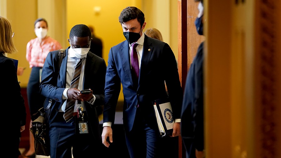 Sen. Jon Ossoff (D-Ga.) leaves the weekly Senate Democratic policy luncheon on Tuesday, September 21, 2021.