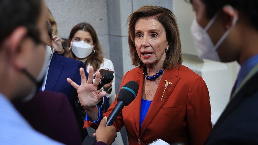 Speaker House Nancy Pelosi (D-Calif.) talks with reporters after departing a House Democratic whip meeting in the basement of the U.S. Capitol on September 29, 2021