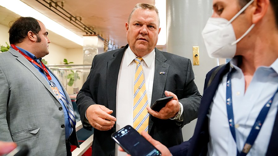 Sen. Jon Tester (D-Mont.) speaks to reporters as he arrives to the Capitol for a vote on Tuesday, July 27, 2021.