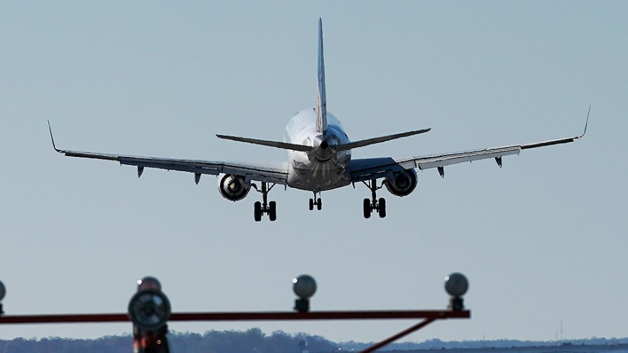 A United Airlines ERJ-170 makes a landing approach at Ronald Reagan National Airport seen at Gravelly Point in Arlington, Va., on Tuesday, March 30, 2021.