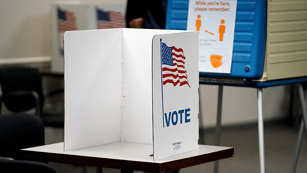 A voting booth is seen at an early voting polling site at the Fairfax County Government Center in Fairfax, Va., on Friday, September 17, 2021.