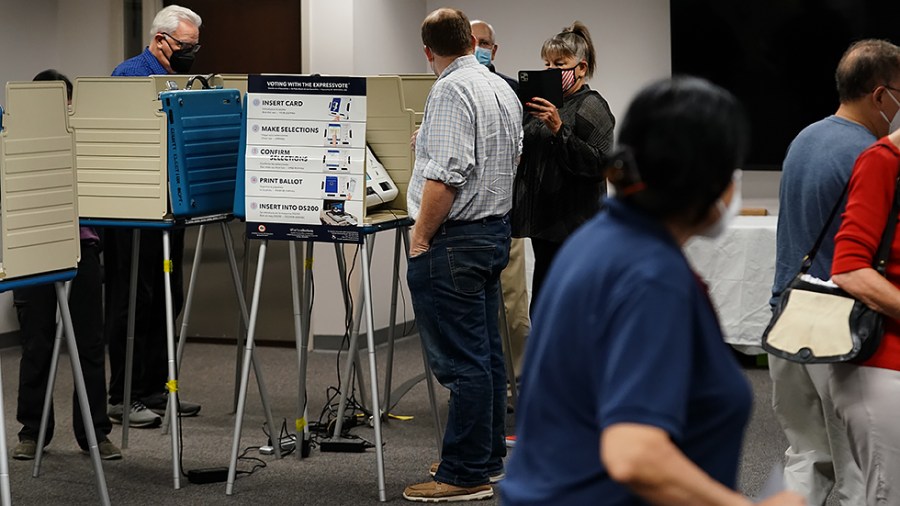 A voter has his photo taken prior to voting early at the Fairfax County Government Center in Fairfax, Va., on Friday, September 17, 2021.