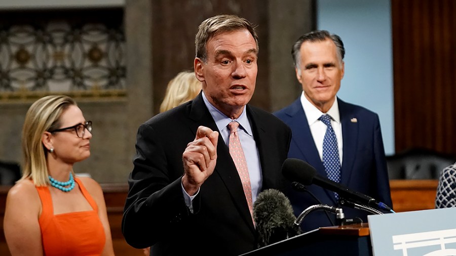 Sen. Mark Warner (D-Va.) addresses reporters after a key vote regarding bipartisan infrastructure legislation on Wednesday, July 28, 2021.