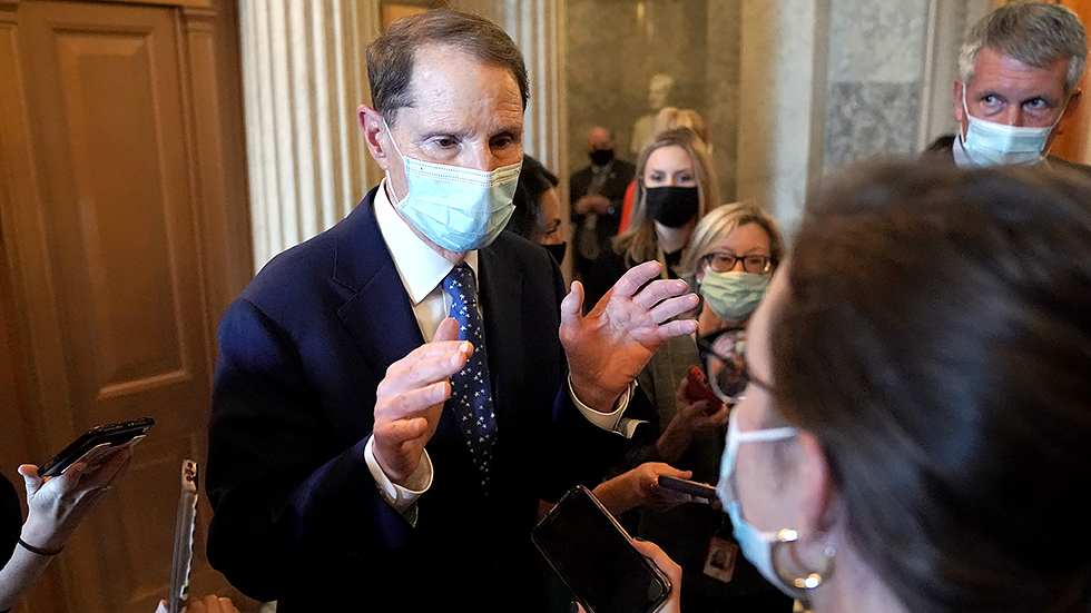 Sen. Ron Wyden (D-Ore.) speaks to reporters outside the Senate Chamber during a nomination vote on Monday, September 20, 2021.