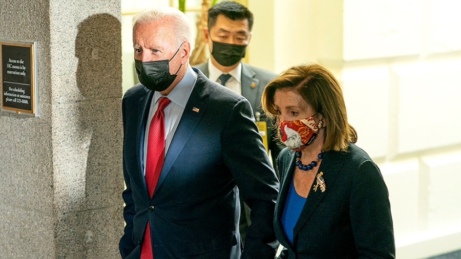 President Biden and Speaker Nancy Pelosi (D-Calif.) leave a Democratic Caucus meeting at the Capitol to discuss the bipartisan infrastructure plan on Friday, October 1, 2021.