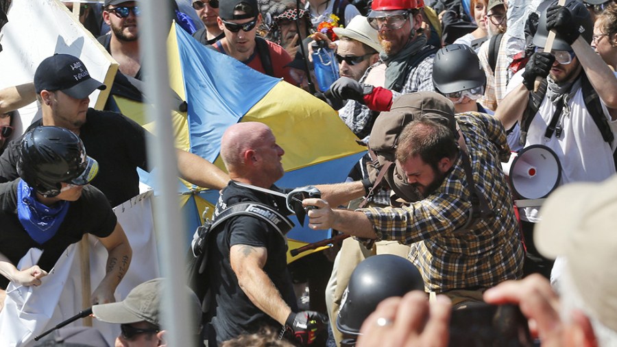 File photo of white nationalist demonstrators clashing with counter demonstrators in Charlottesville on Aug. 12, 2017