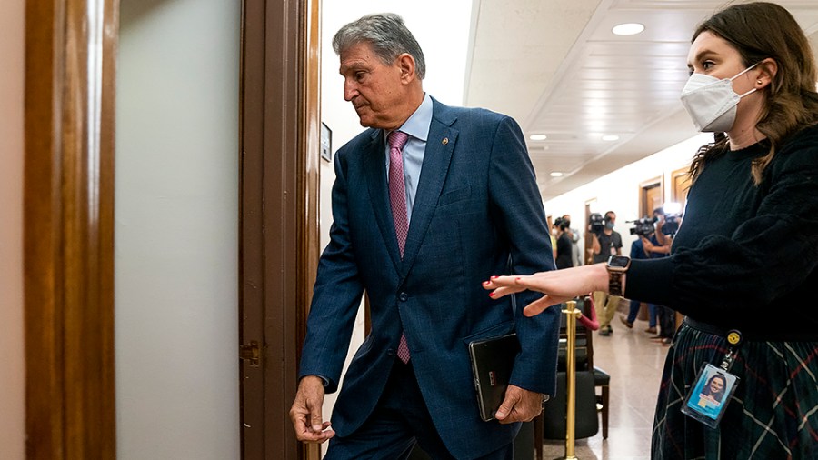 Sen. Joe Manchin (D-W.Va.) arrives for a Senate Energy and Natural Resources Committee hearing on Tuesday, October 5, 2021.