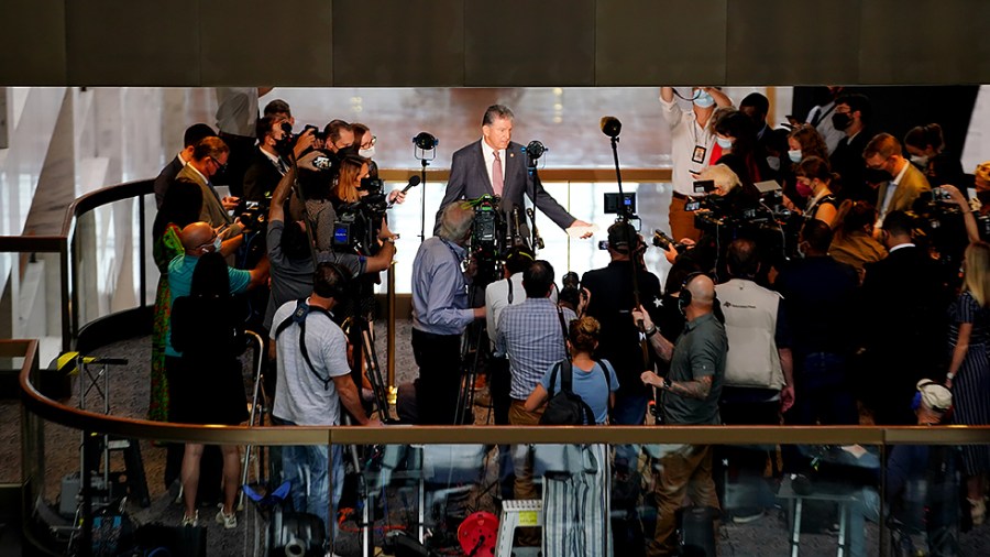 Sen. Joe Manchin (D-W.Va.) makes a statement outside his office in the Hart Senate Office Building regarding the bipartisan infrastructure plan and other agenda items on Wednesday, October 6, 2021.