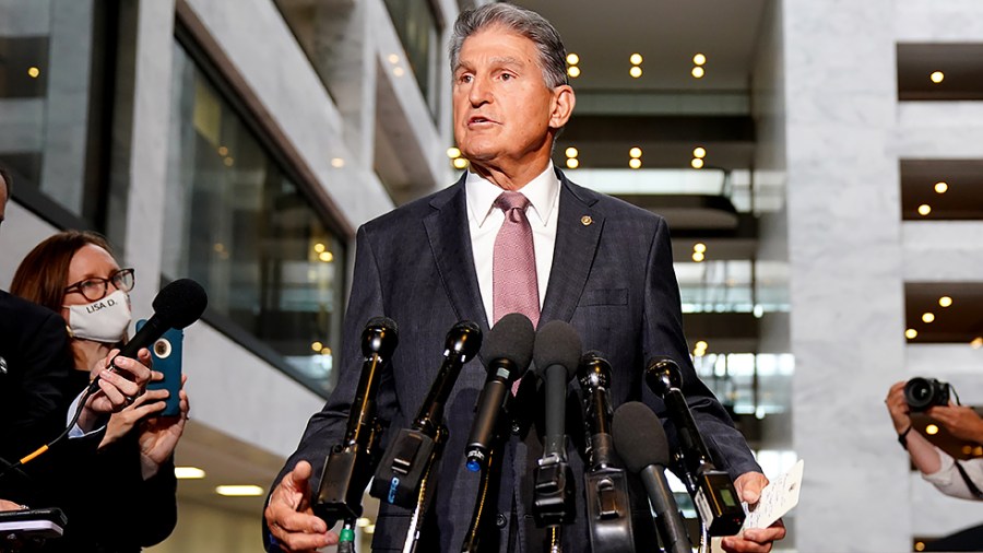 Sen. Joe Manchin (D-W.Va.) makes a statement outside his office in the Hart Senate Office Building regarding the bipartisan infrastructure plan and other agenda items on Wednesday, October 6, 2021.