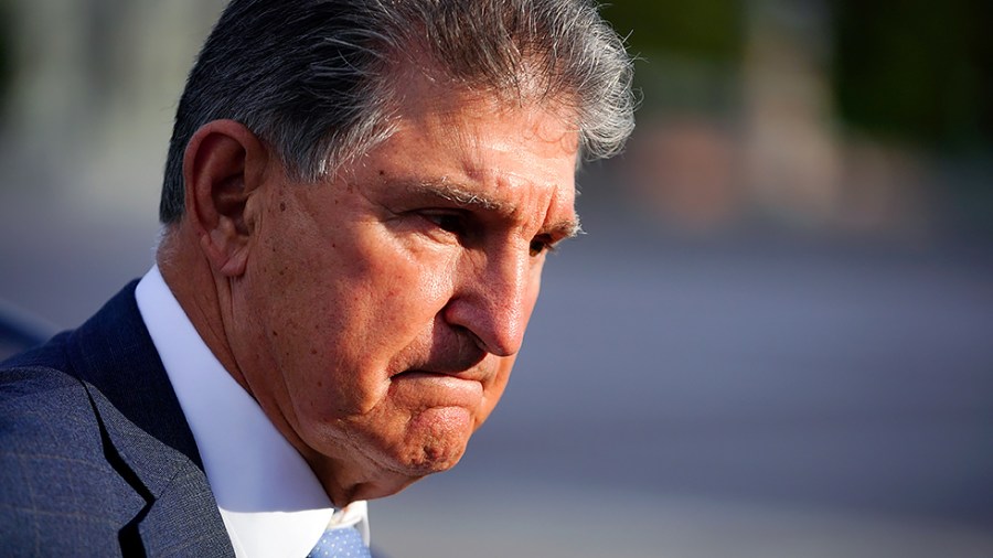 Sen. Joe Manchin (D-W.Va.) speaks to reporters after leaving the Capitol following a nomination vote on Thursday, October 7, 2021.