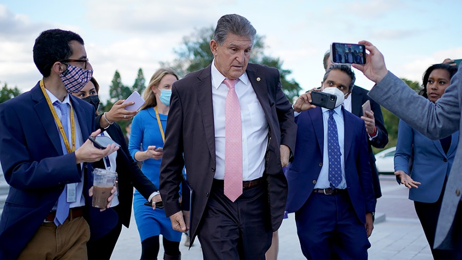 Sen. Joe Manchin (D-W.Va.) speaks to reporters as leaves the Capitol following votes on Thursday, October 28, 2021.