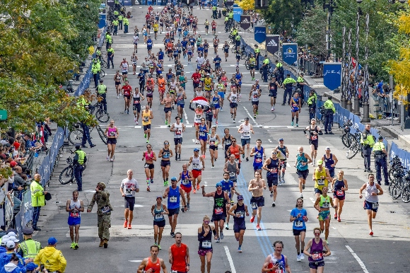 Runners make their way to the finish line down Boylston Street during the 125th Boston Marathon