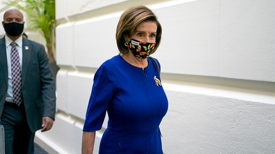 Speaker Nancy Pelosi (D-Calif.) arrives for a closed-door Democratic caucus meeting on Tuesday, October 26, 2021.