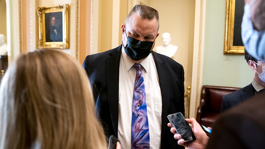 Sen. Jon Tester (D-Mont.) addresses reporters before the weekly Senate Democratic policy luncheon on Tuesday, October 19, 2021.