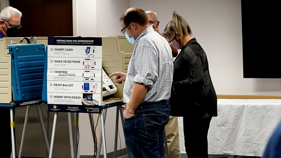 A voters are seen at an early voting polling site at the Fairfax County Government Center in Fairfax, Va., on Friday, September 17, 2021.