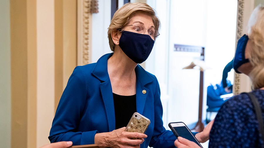 Sen. Elizabeth Warren (D-Mass.) speaks to a reporter before the weekly Senate Democratic policy luncheon on Tuesday, October 5, 2021.