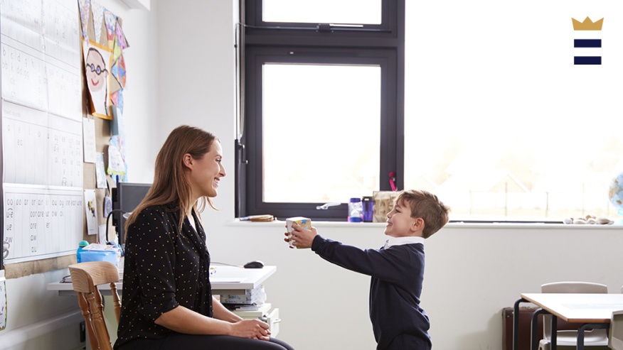 child presenting a gift to a teacher