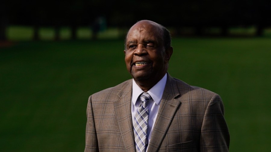 Lee Elder poses for a picture on the first tee at the Masters golf tournament