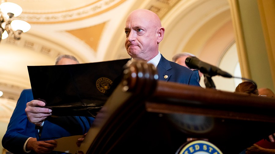 Sen. Mark Kelly (D-Ariz.) addresses reporters after the weekly policy luncheon on Tuesday, November 16, 2021.