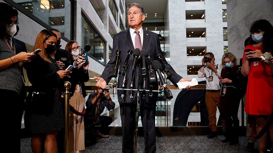 Sen. Joe Manchin (D-W.Va.) makes a statement outside his office in the Hart Senate Office Building regarding the bipartisan infrastructure plan and other agenda items on Wednesday, October 6, 2021.