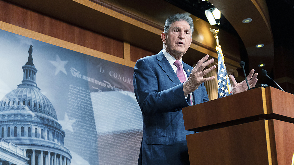 Sen. Joe Manchin (D-W.Va.) addresses reporters about his views on the bipartisan infrastructure plan on Monday, November 1, 2021.