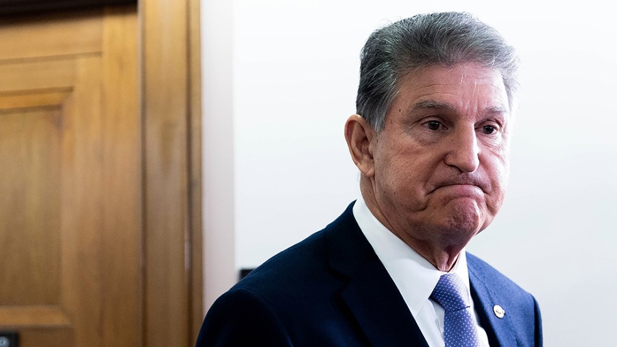 Sen. Joe Manchin (D-W.Va.) speaks to reporters prior to a Senate Energy and Natural Resources Committee hearing on Tuesday, Nov. 16, 2021.