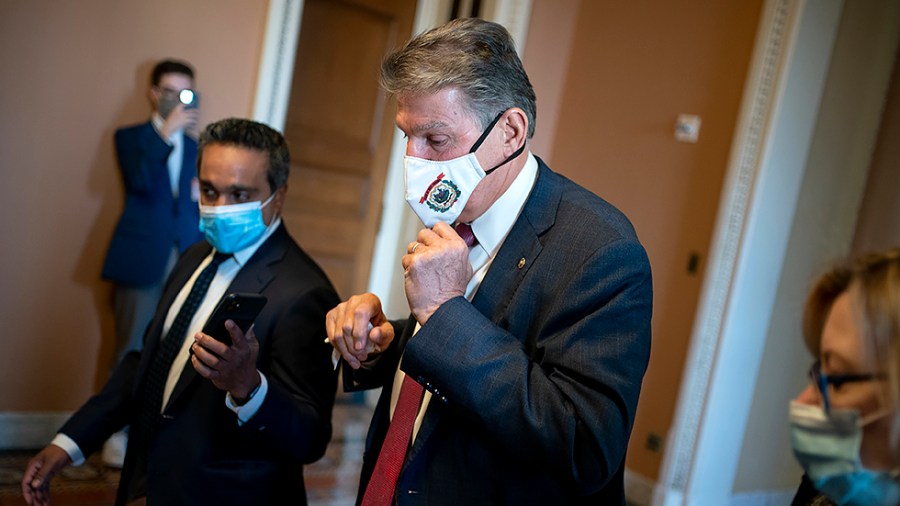 Sen. Joe Manchin (D-W.Va.) speaks to reporters as he leaves Minority Leader Mitch McConnell’s (R-Ky.) office after a meeting on Tuesday, November 30, 2021.