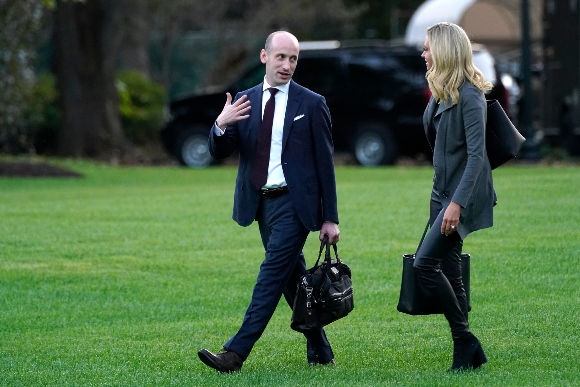 White House press secretary Kayleigh McEnany and White House senior adviser Stephen Miller walk across the South Lawn