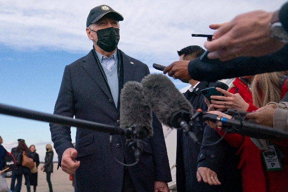 President Joe Biden speaks to media as he arrives on Air Force one at Andrews Air Force Base, Md.