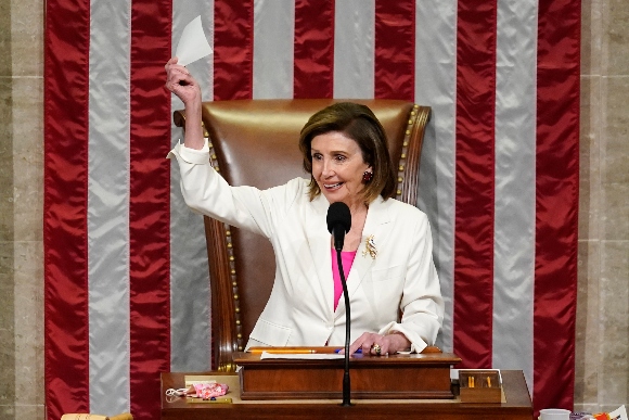 Speaker of the House Nancy Pelosi, D-Calif., presides over House passage of President Joe Biden's expansive social and environment bill